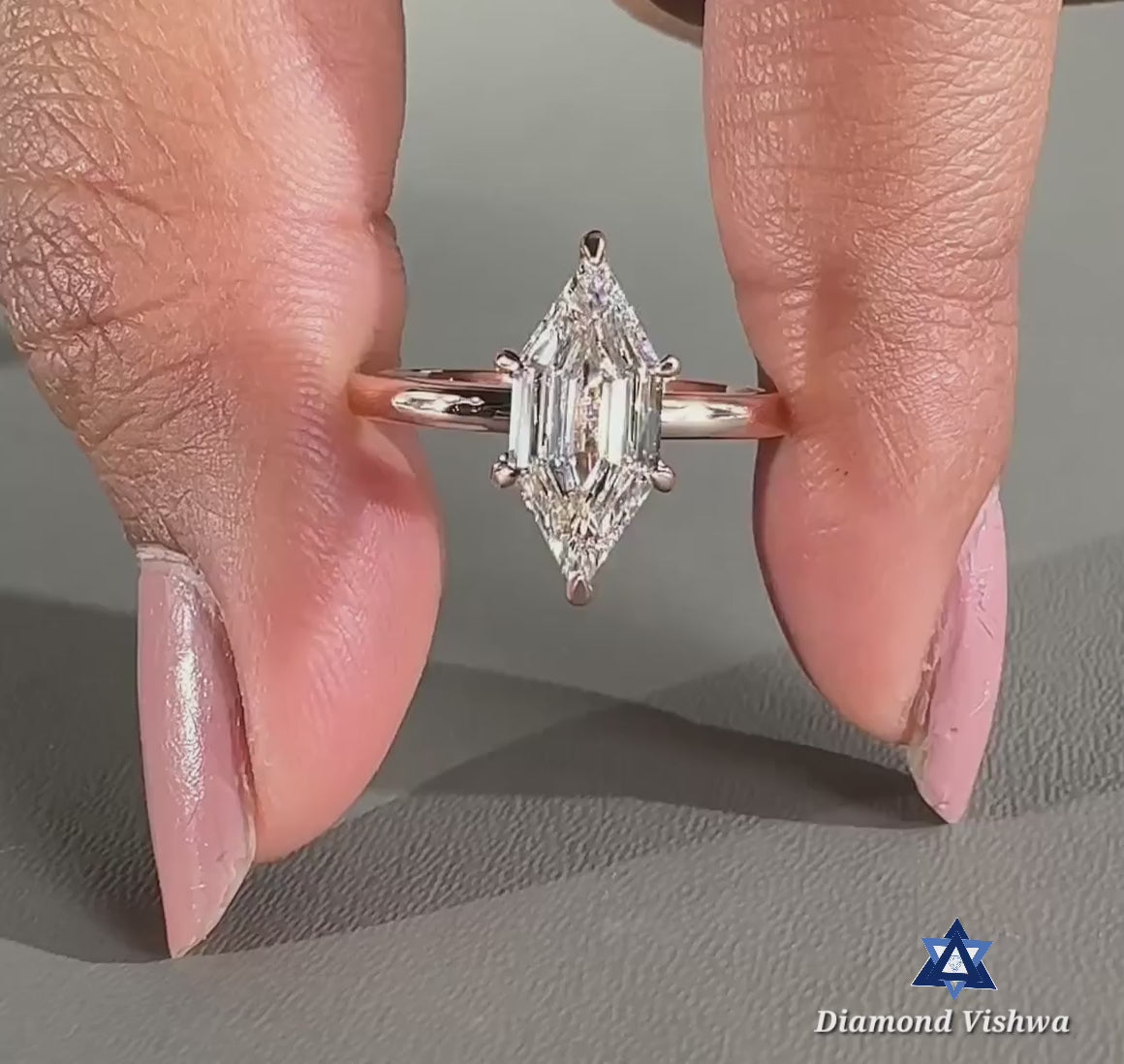 6a0b596072dd4cdf9c154d9bc044ebdb.thumbnail.0000000000 Elongated Hexagon Step Cut Moissanite Solitaire Engagement Ring - 925 Silver - Image 1